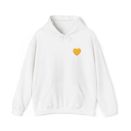 It is a yellow heart on a hoodie that symbolizes friendship and happiness.